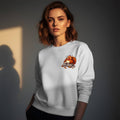 Woman wearing a white Gildan 18000 crewneck sweatshirt with small left chest Thanksgiving print of a sleepy stuffed turkey in gray sweatpants