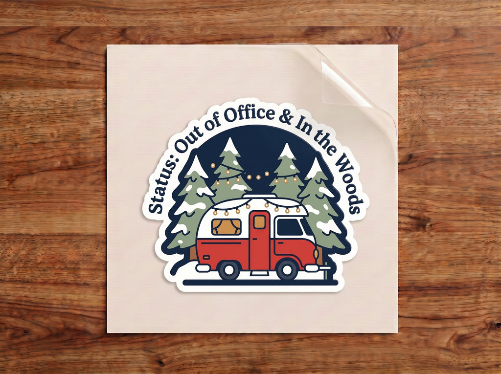 Status: Out of Office & In the Woods sticker – red camper with string lights under snowy pine trees