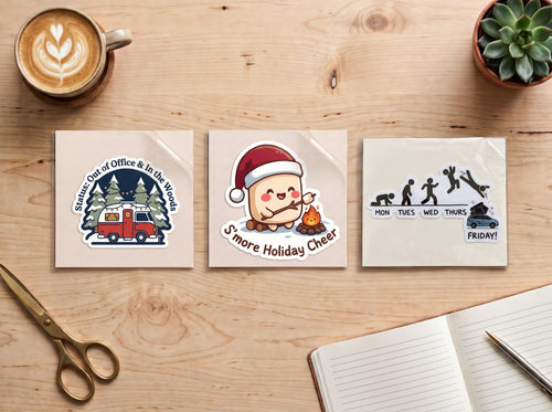Camping sticker bundle – Out of Office & In the Woods, S'more Holiday Cheer and Mon to Friday stickers side by side on a wooden desk