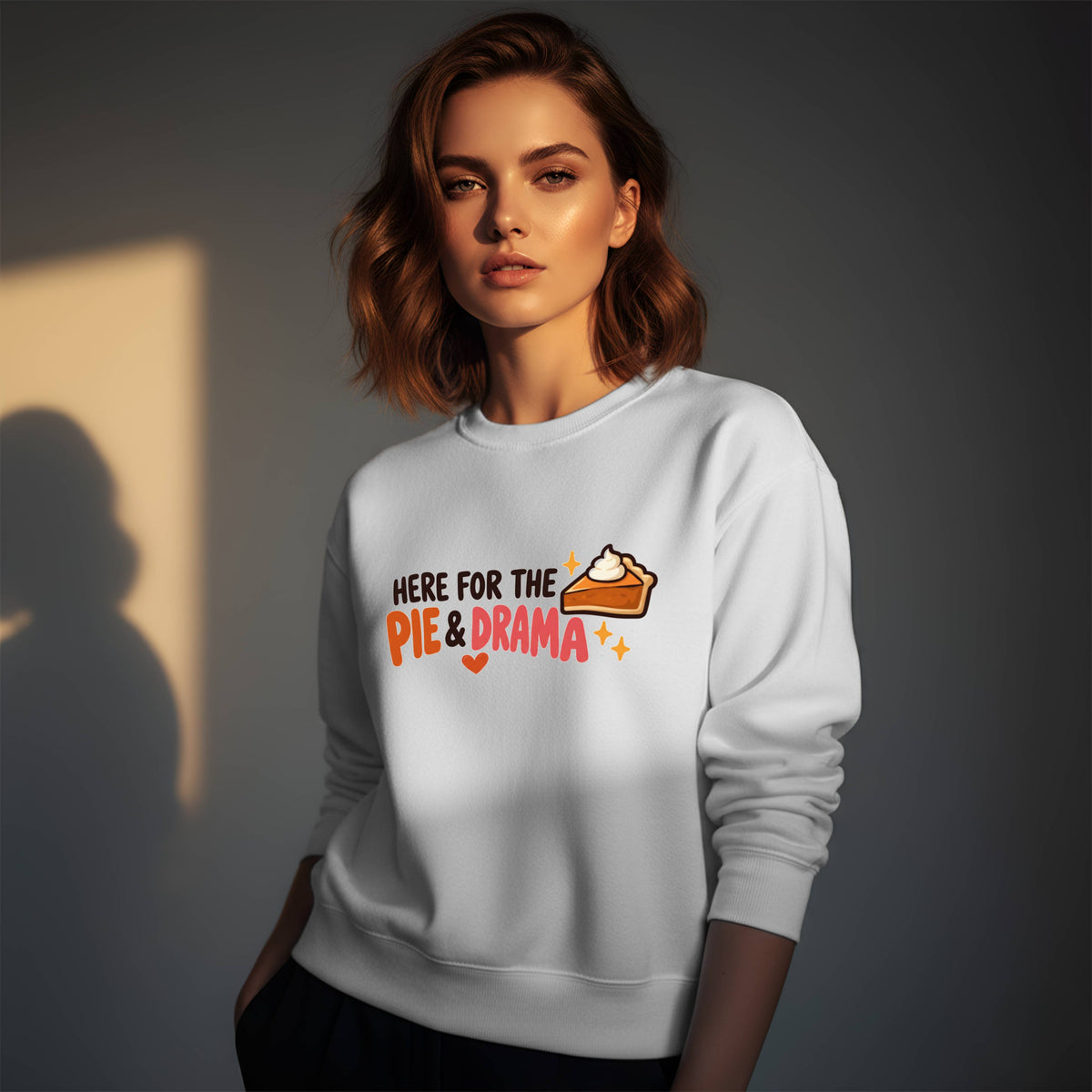 Woman wearing a white Gildan 18000 crewneck sweatshirt with funny Thanksgiving Here for the Pie & Drama design and pumpkin pie slice